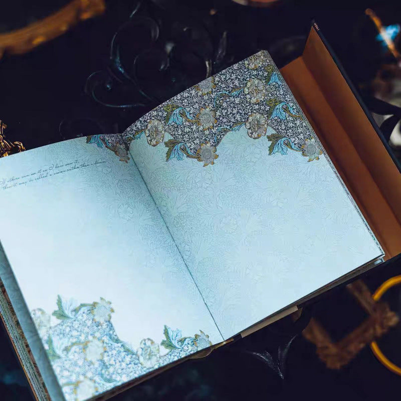 Open book with decorative pages on a dark background