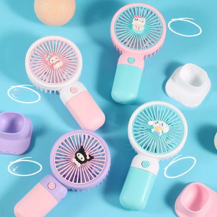 A collection of small, portable, rechargeable hand fans in various pastel colors, each featuring a cute animal design on the front.
