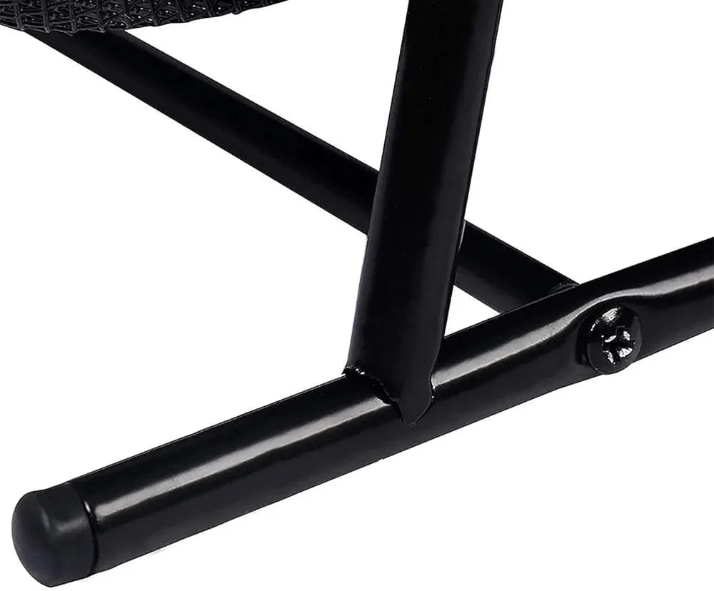 Close-up of a black metal chair frame on a white background