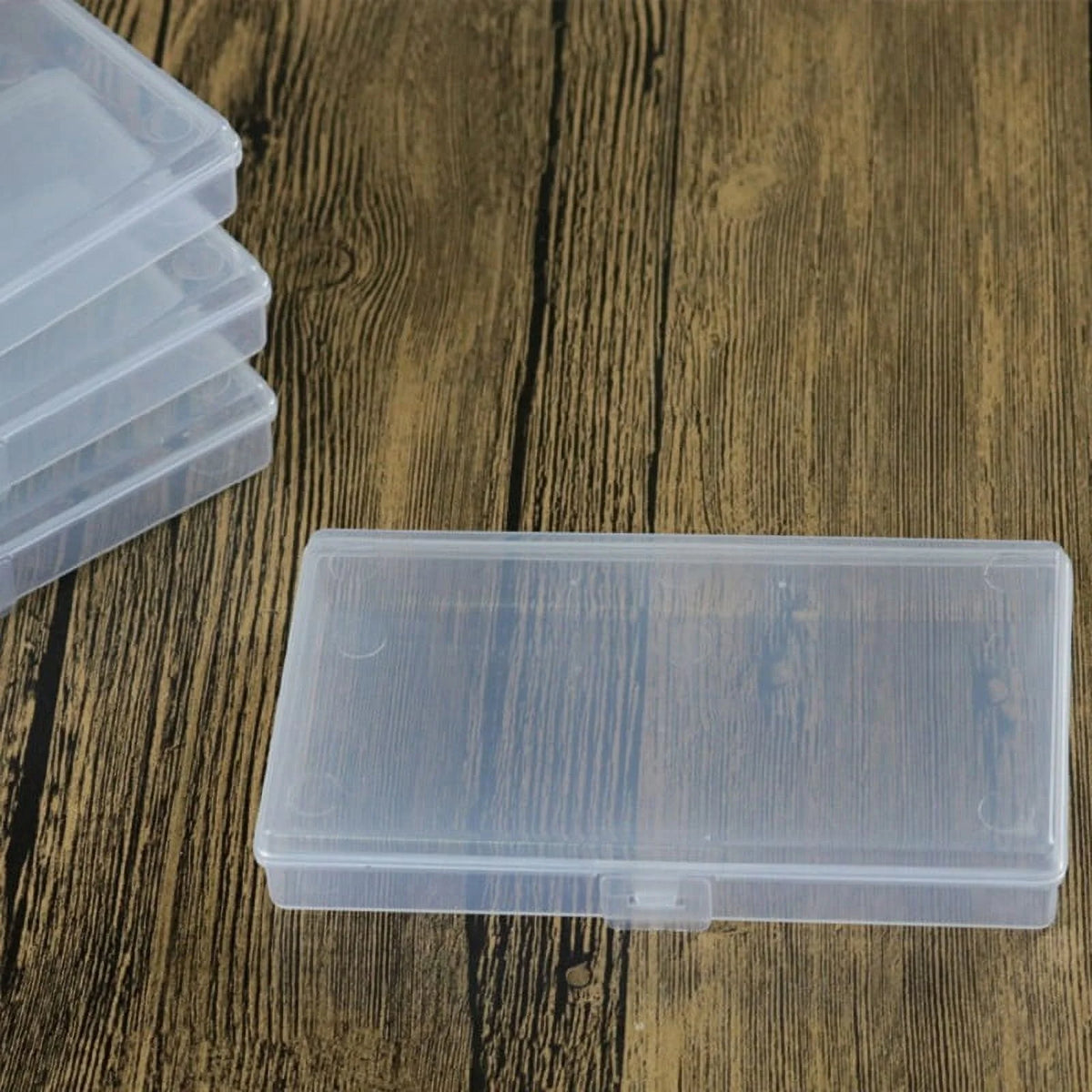 Clear plastic storage box on a wooden surface