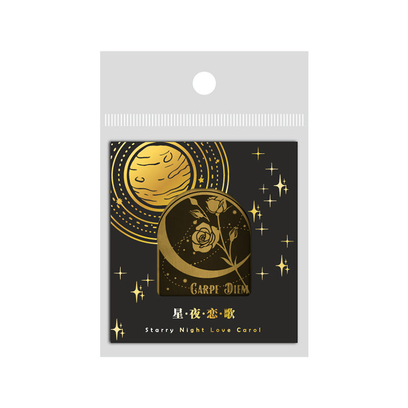 Packaged product with gold moon and rose design on a black background, featuring 'Carpe Diem' text.