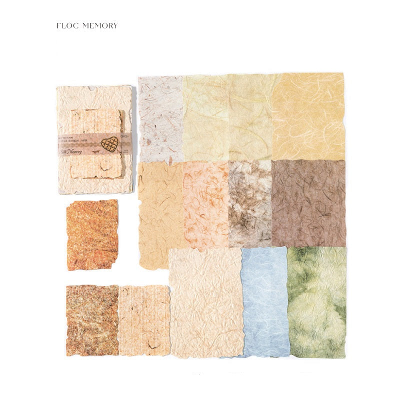 Collection of textured paper squares in various colors on a white background