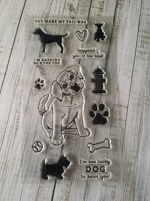 Clear stamp set with dog-themed designs on a wooden surface