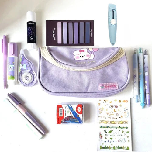 Collection of stationery items including a purple pouch, pens, and stickers on a white background