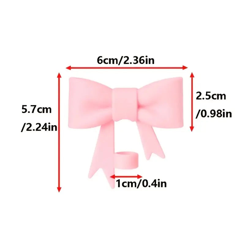 Measurement chart of a pink bow with dimensions labeled in centimeters and inches.