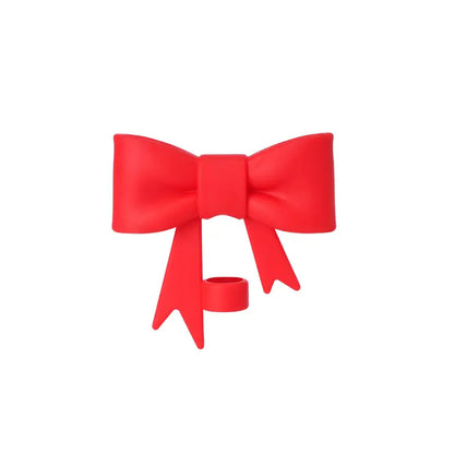 Red bow-shaped object on a white background