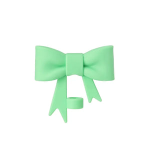 Light green bow-shaped hair clip on a white background