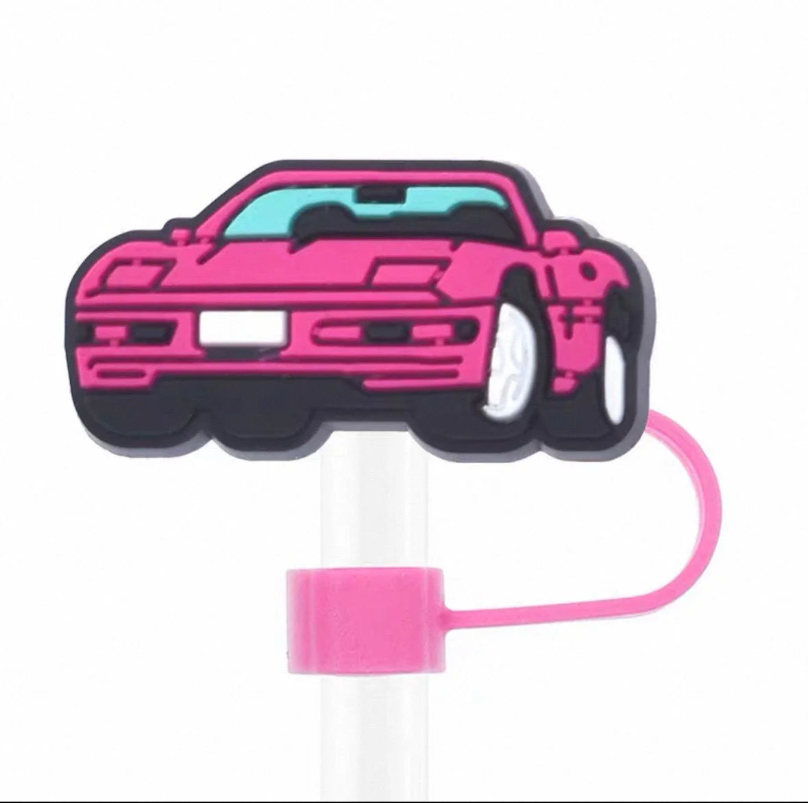 Pink car-shaped straw with a white handle on a white background
