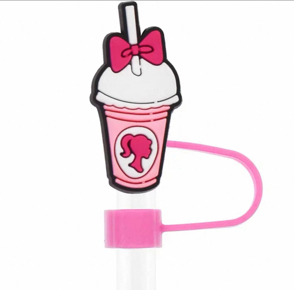 Pink cartoon-style milkshake with a bow and straw on a white background