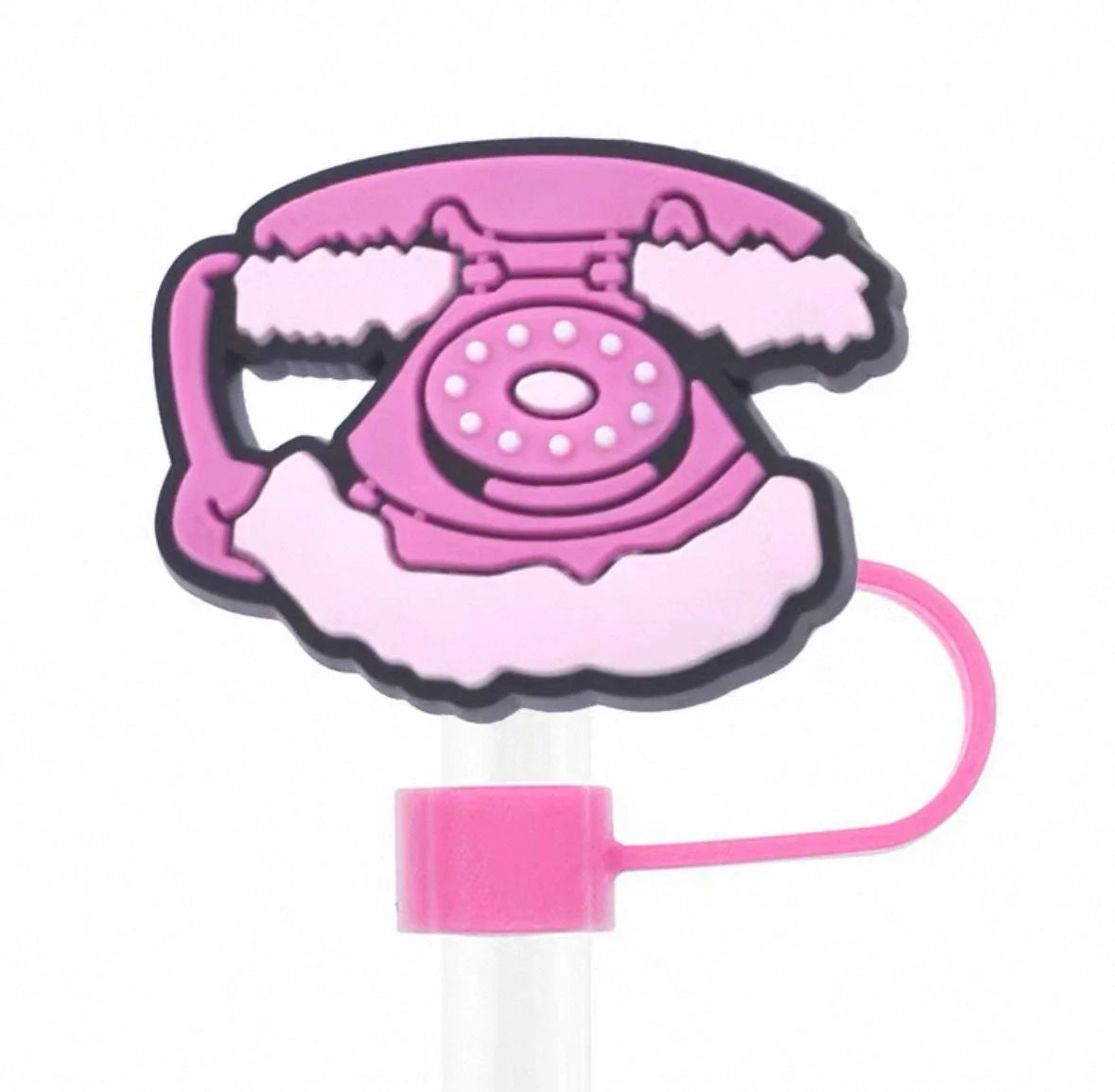 Pink rotary phone-shaped hair tie on a white background