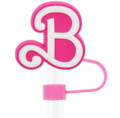 Pink letter 'B' candle on a white background