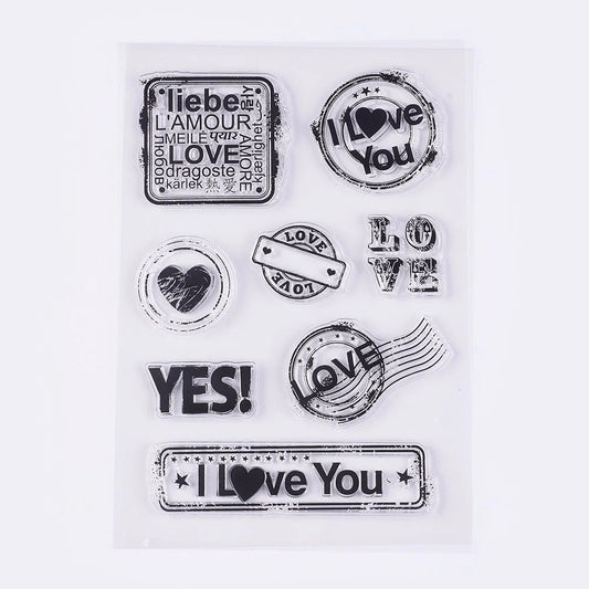 Set of clear stamps with love-themed designs on a white background