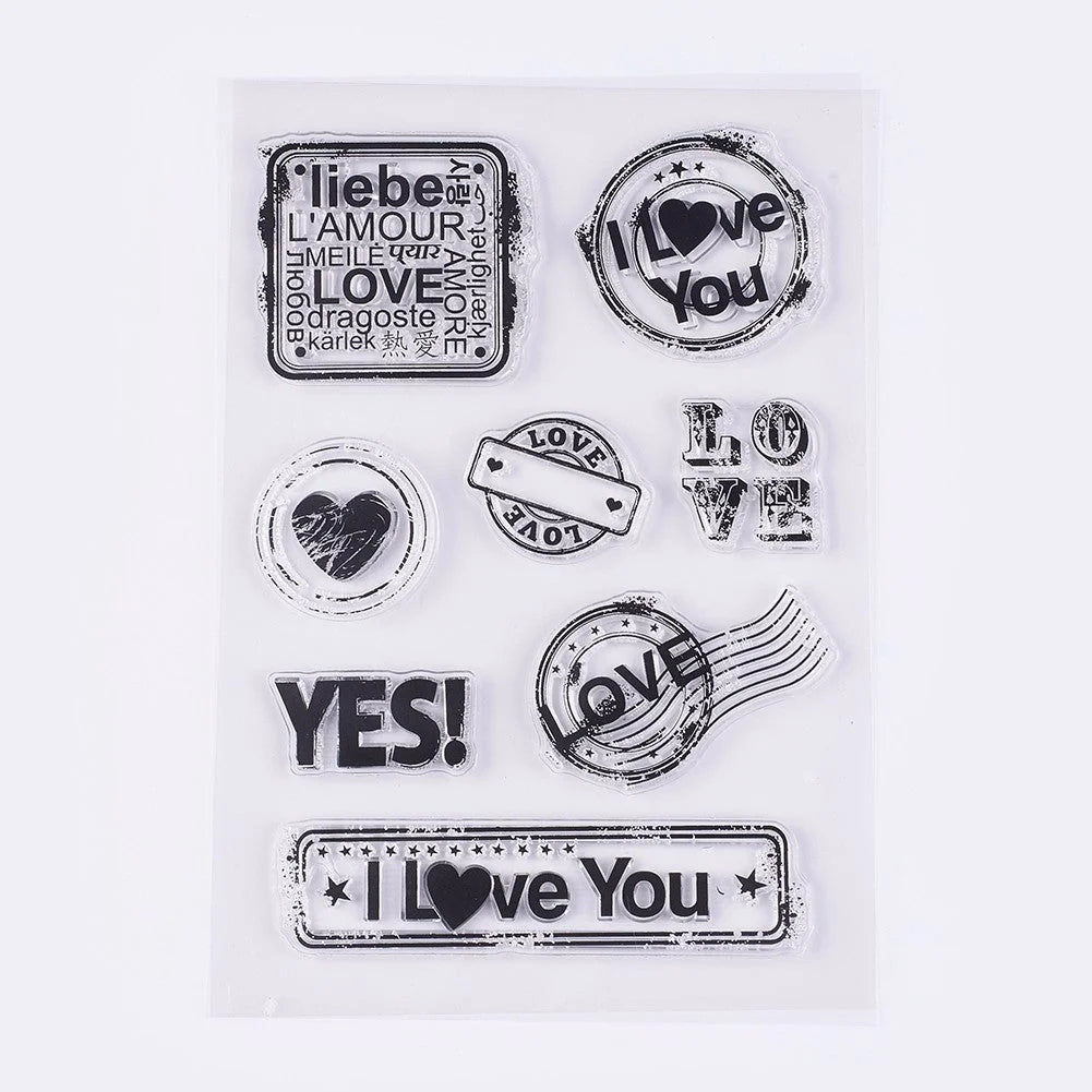 Set of clear stamps with love-themed designs on a white background