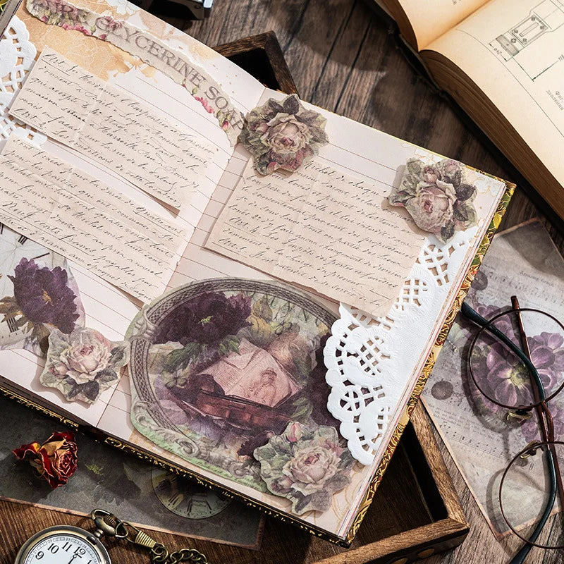 Decorative open book with floral elements on a wooden surface