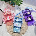 Three colorful water bottles with cartoon designs on a textured surface.