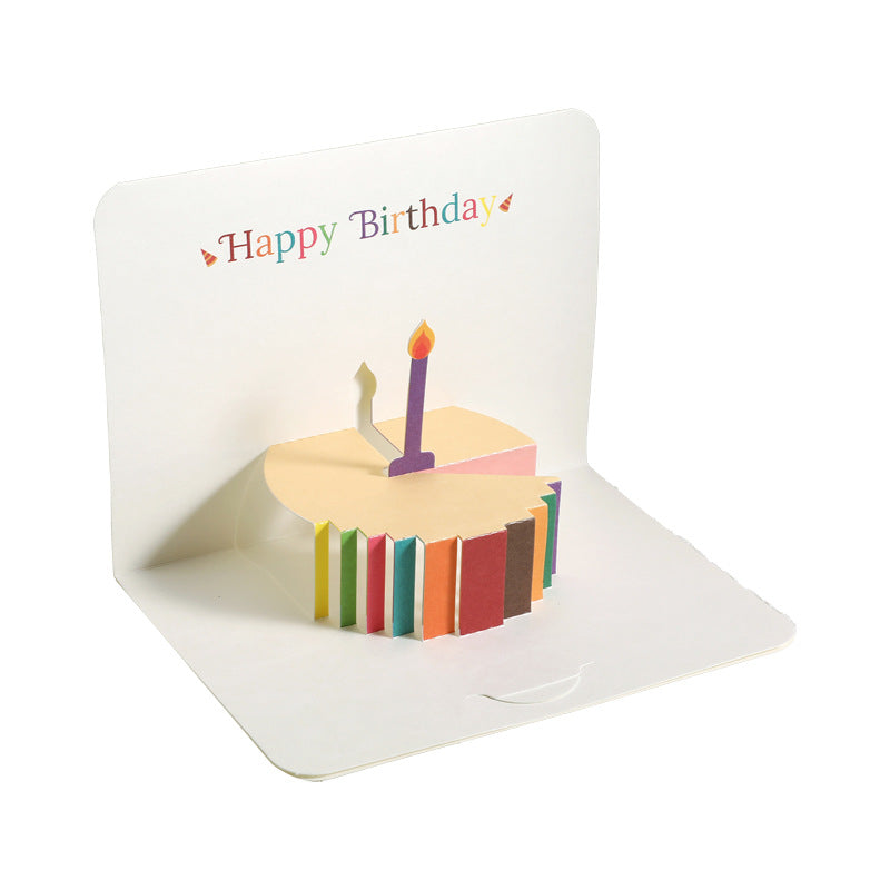 Pop-up birthday card with a cake and candle design on a white background