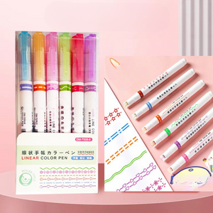 A set of 6 colorful marker pens with chisel tips, displayed alongside a piece of paper with decorative star, heart, and dot patterns.